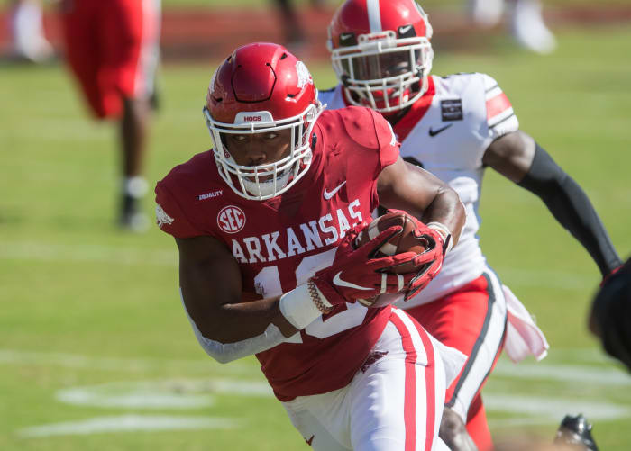 Arkansas Razorbacks wide receiver Treylon Burks (16) gets past Georgia Bulldogs defensive back Richard LeCounte (2) and goes on to score a touchdown during the first quarter at Donald W. Reynolds Razorback Stadium. Georgia won the game 37-10.
